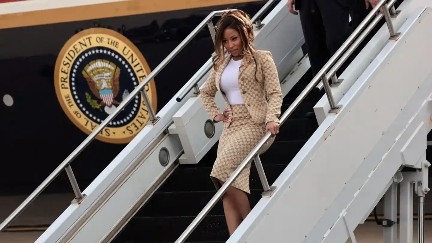 Rapper Nicki Minaj exits Air Force One after traveling aboard the presidential aircraft with President Donald Trump for a Republican campaign rally in Michigan.