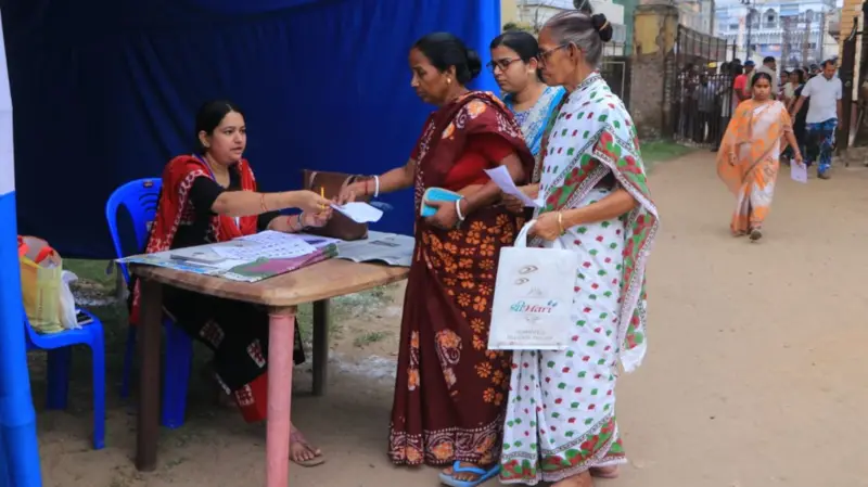 In West Bengal, during the second phase, people are casting their votes at polling stations.