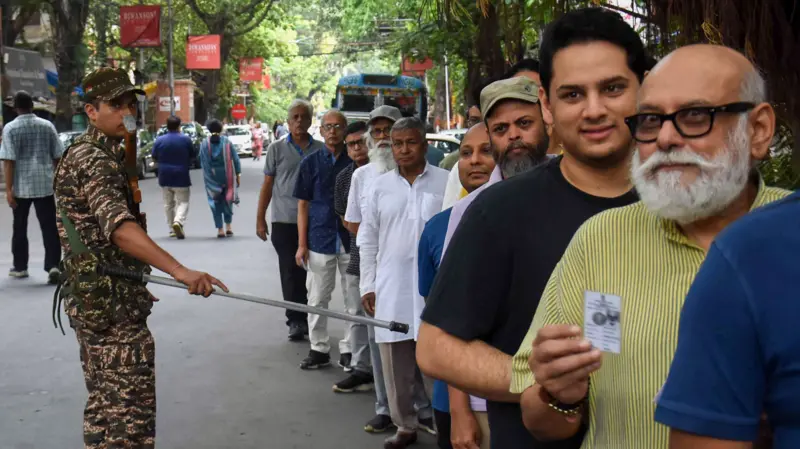On Wednesday in Kolkata, voters standing in queue to cast their votes during the second phase of the West Bengal Assembly Election 2026.