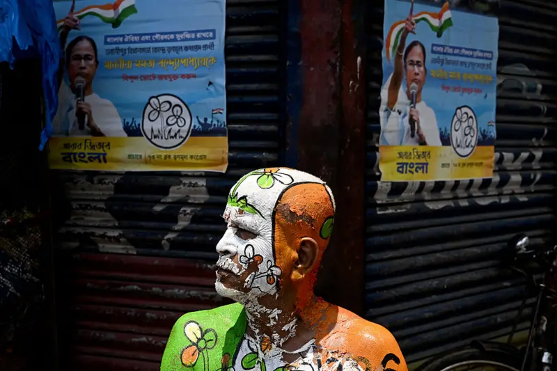 TMC supporter with the party election symbol painted on his body.