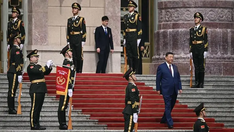 At the Great Hall of the People, China’s Xi Jinping came down to meet Donald Trump.