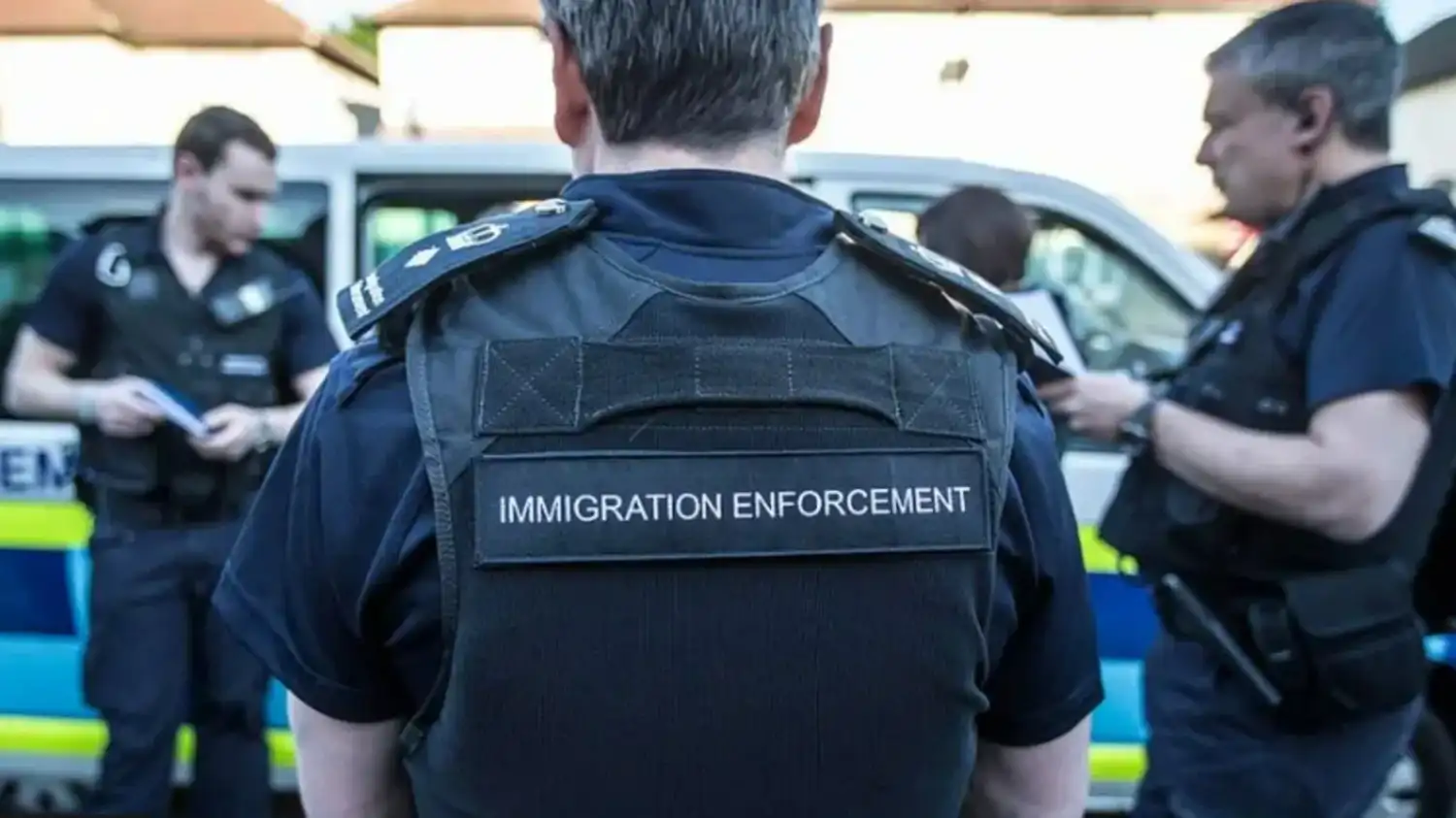 Immigration enforcement officers during an official operation.