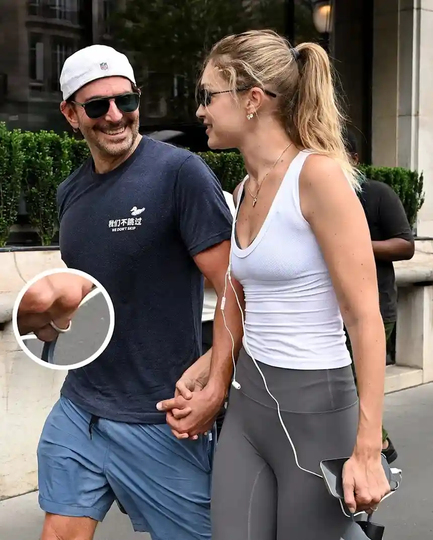 Hadid wearing her band with Cooper in Paris