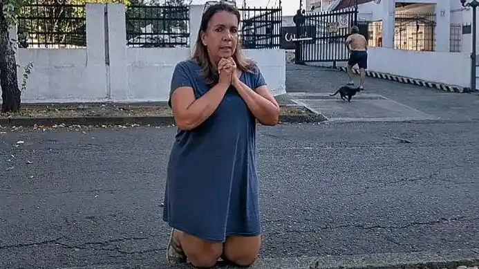 A woman praying on the street after an earthquake in Colombia.