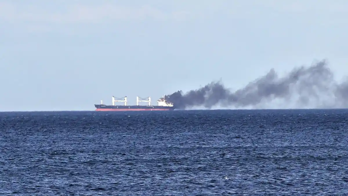 Smoke rises from a ship damaged by a purported Russian attack in the Black Sea last month.