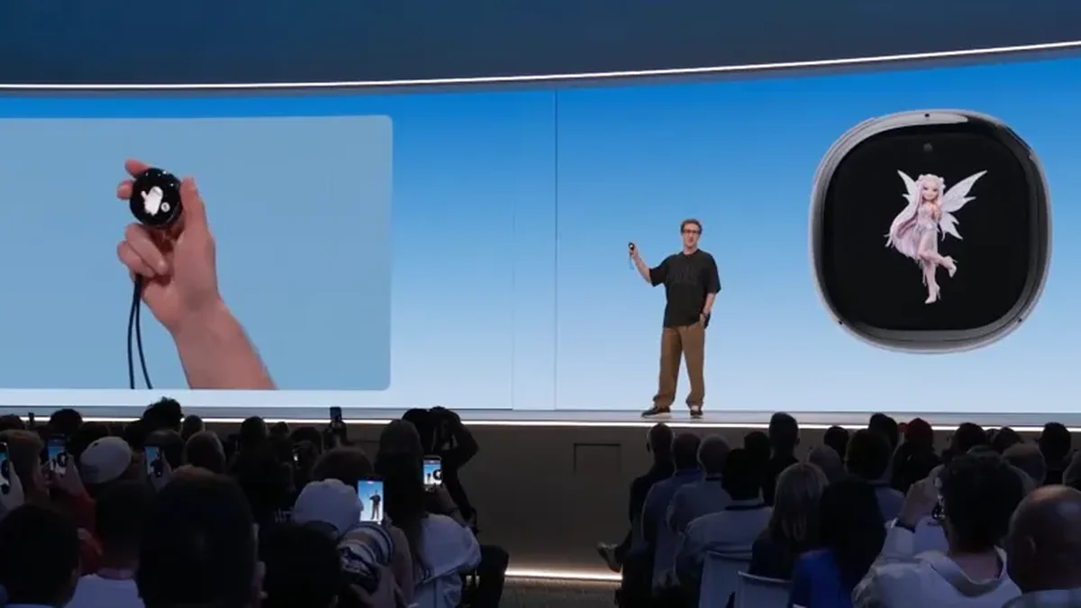 Meta demonstrates a neural wristband and smart glasses with an augmented-reality display on stage during a product presentation.