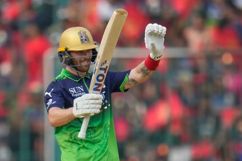 Phil Salt celebrates his 30-ball fifty at M. Chinnaswamy Stadium in Bengaluru.