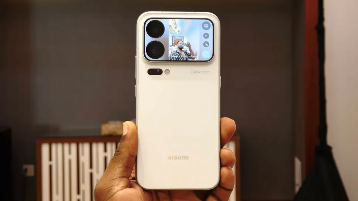 Xiaomi smartphone with Leica camera system held in a hand, showing the rear camera module and camera preview screen