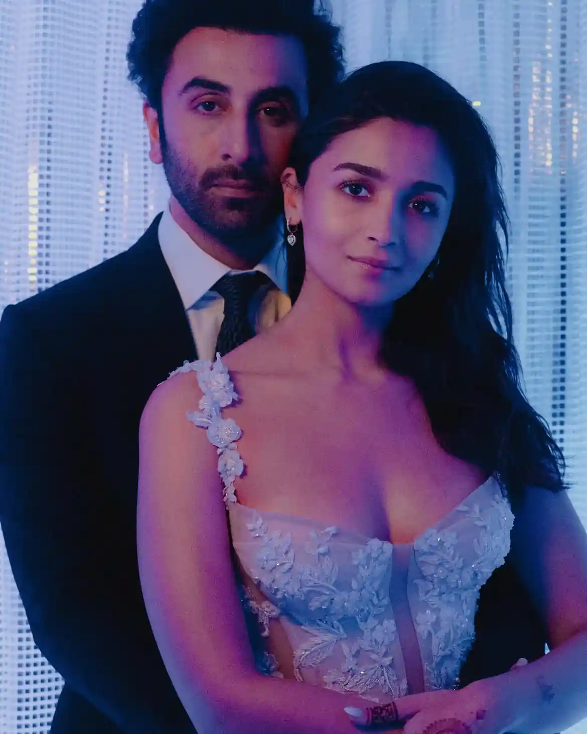 Ranveer Kapoor and Alia pose for a photoshoot, embracing each other in their arms.