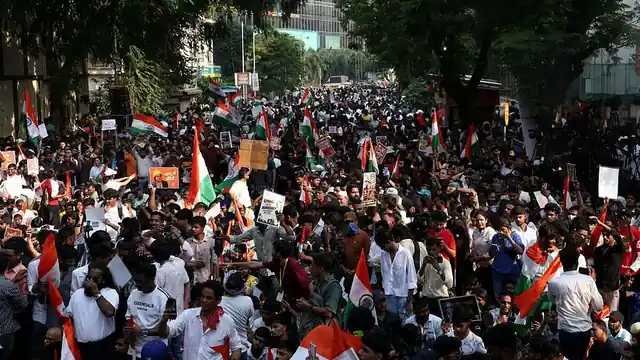 Supporters of Cockroach Janta Party (CJP) attend a protest demanding the resignation of India's Chief Election Commissioner Gyanesh Kumar, in Mumbai. 