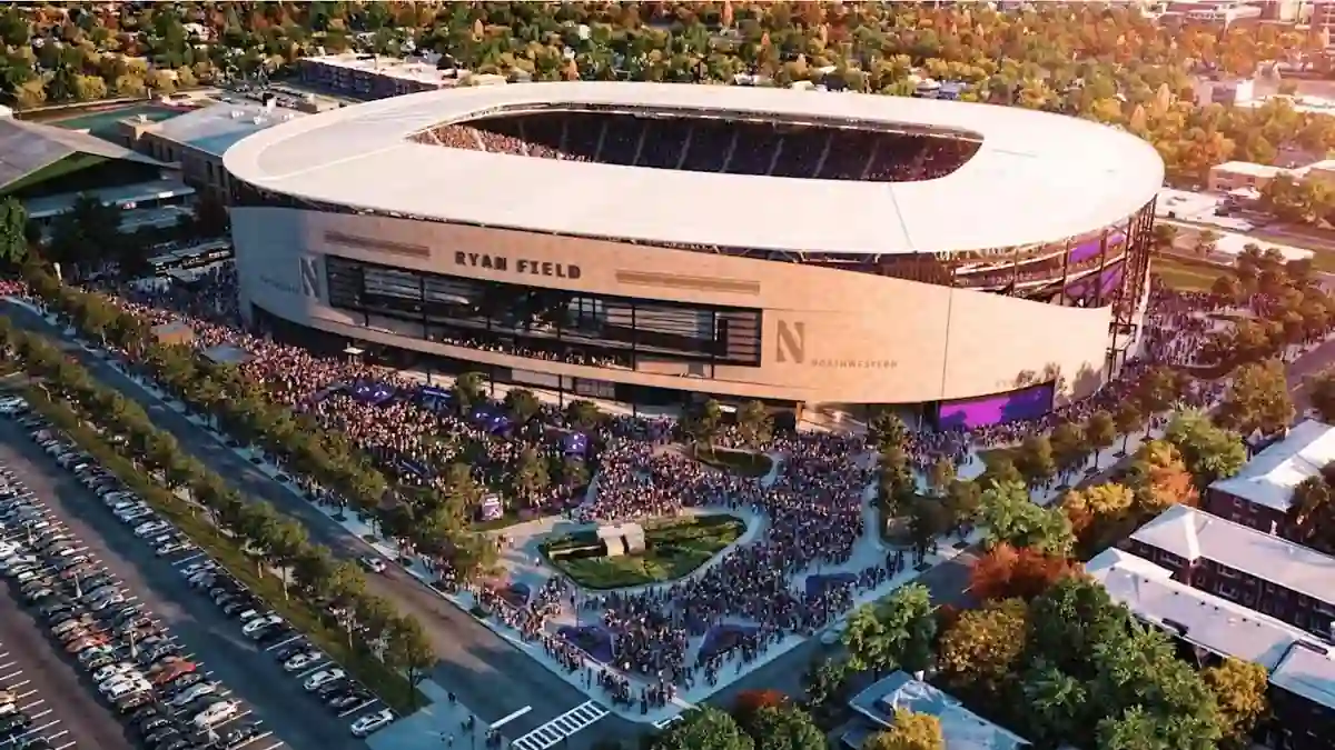 Aerial view of Northwestern's new Ryan Field stadium surrounded by fans and campus buildings