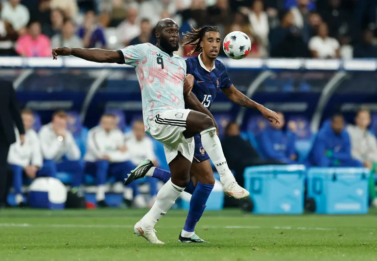 Belgium’s Romelu Lukaku in action with France’s Leny Yoro
