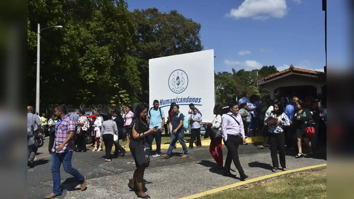 People gather outside buildings in Panama following a reported earthquake.