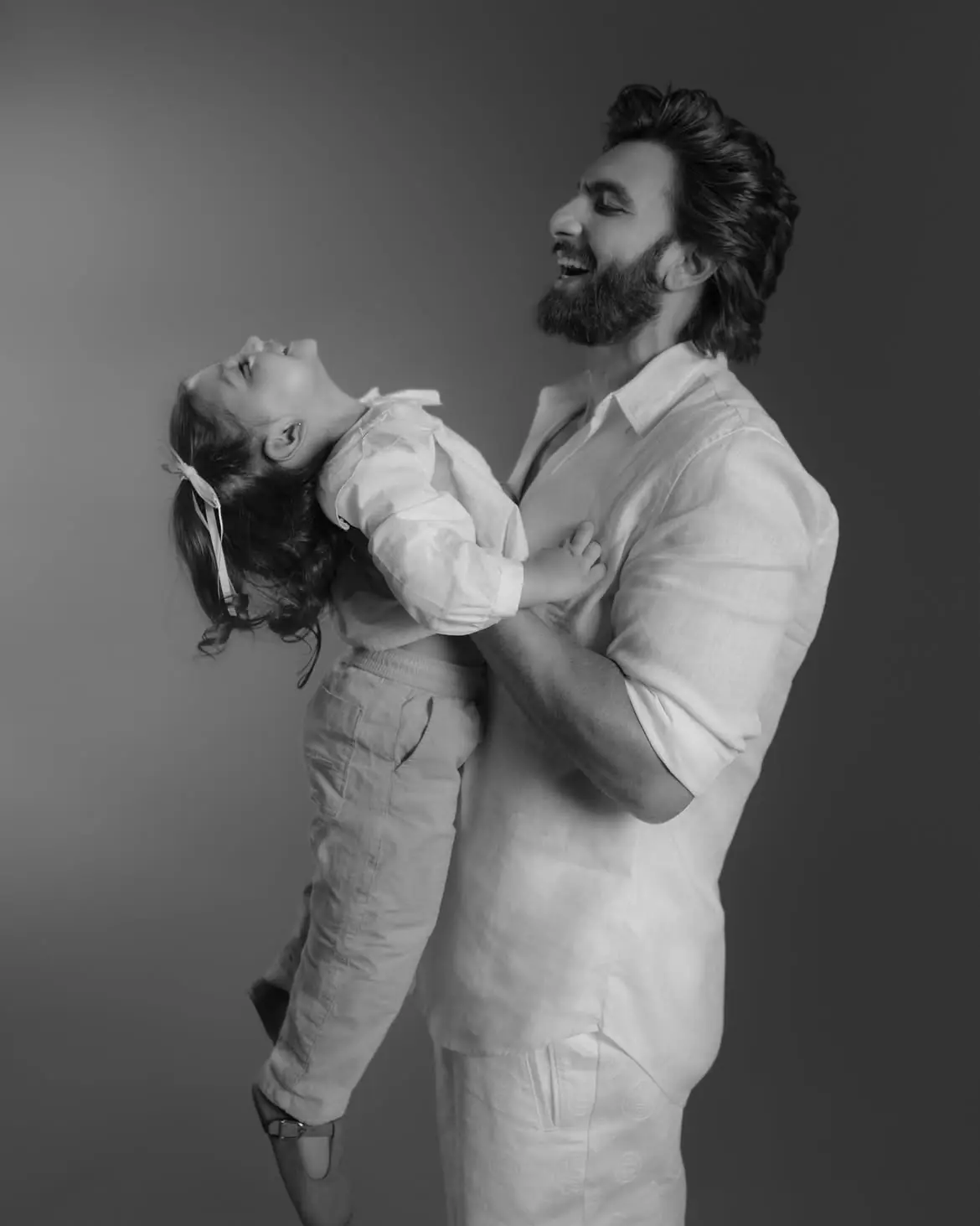 The image features Ranveer Singh and their daughter, Dua.