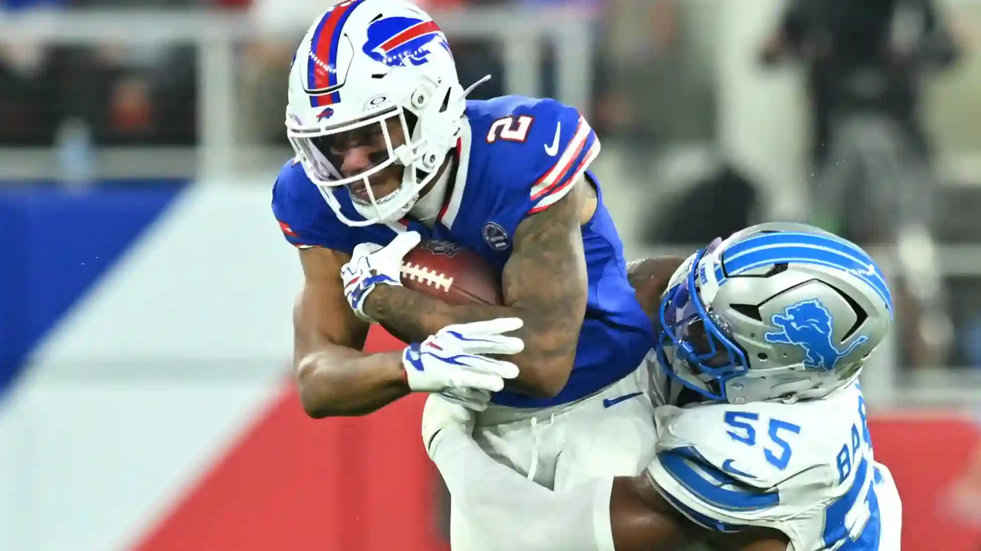 Detroit Lions LB Derrick Barnes tackles Buffalo Bills WR DJ Moore during the first half at New Highmark Stadium.