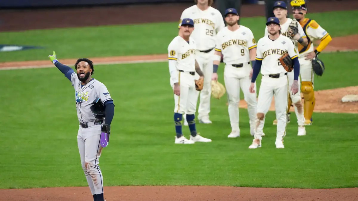 The Rays’ Junior Caminero celebrates after a call is overturned during the ninth inning of Friday’s World Series opener against the Brewers.