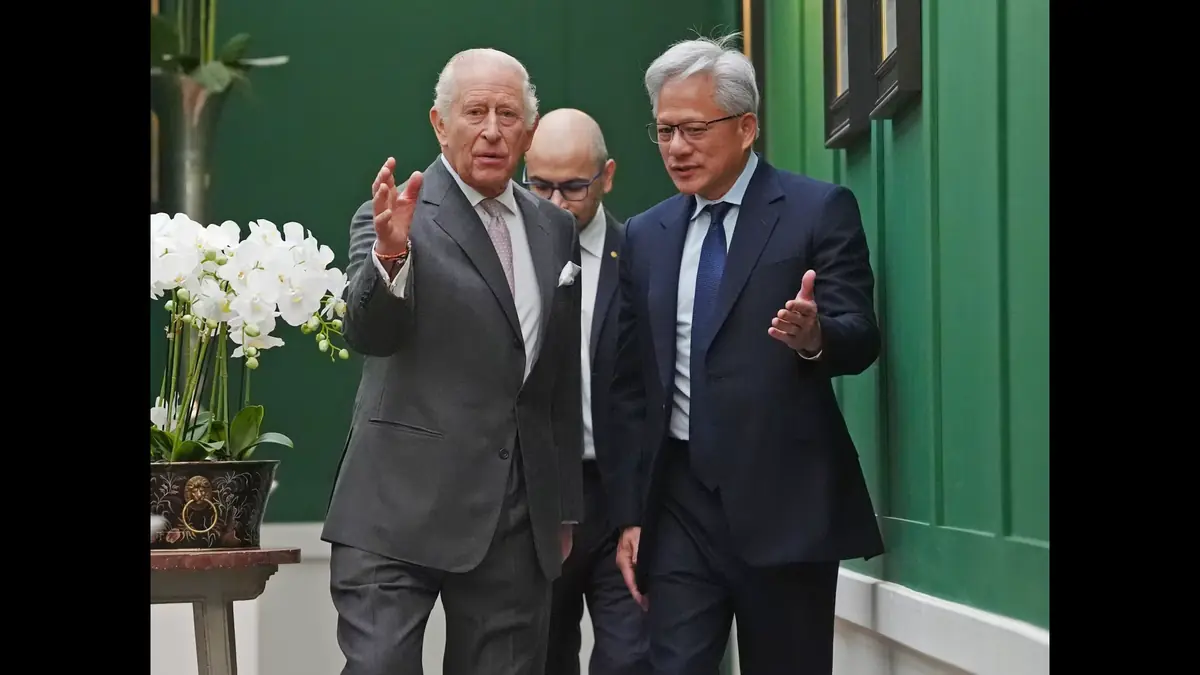 King Charles III walks with Nvidia chief executive Jensen Huang and DeepMind's Demis Hassabis, behind, in Scotland on Thursday.