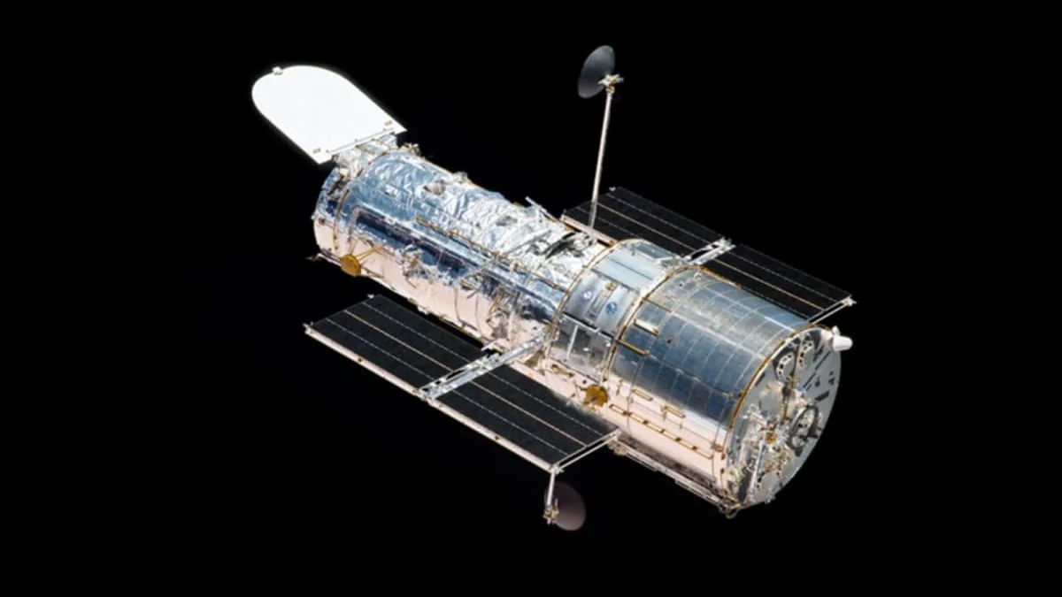 The Hubble space telescope photographed in low-Earth orbit.
