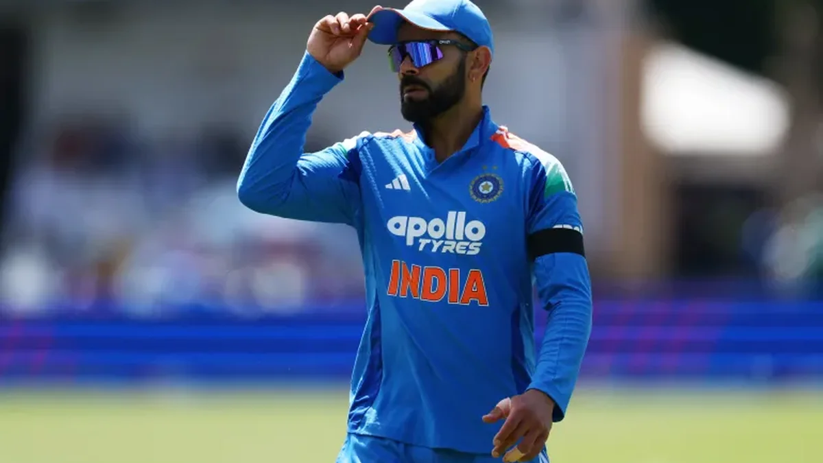 Virat Kohli in India blue jersey adjusts his cap during ODI match against West Indies ahead of 2027 World Cup