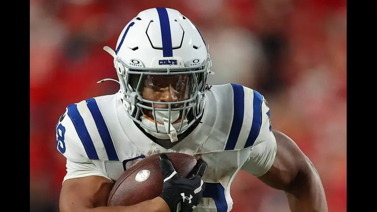 Indianapolis Colts running back carrying the football during an NFL game.