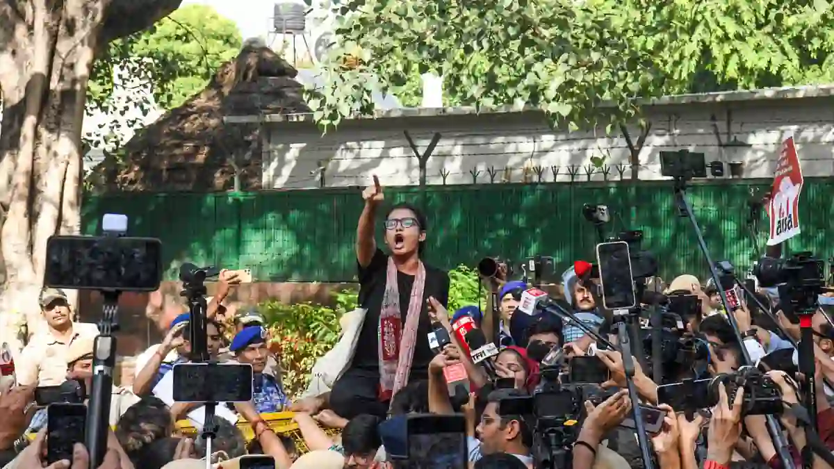AISA President Neha Bora, along with other protesters, raises slogans during a protest near Jantar Mantar, in New Delhi on Saturday.